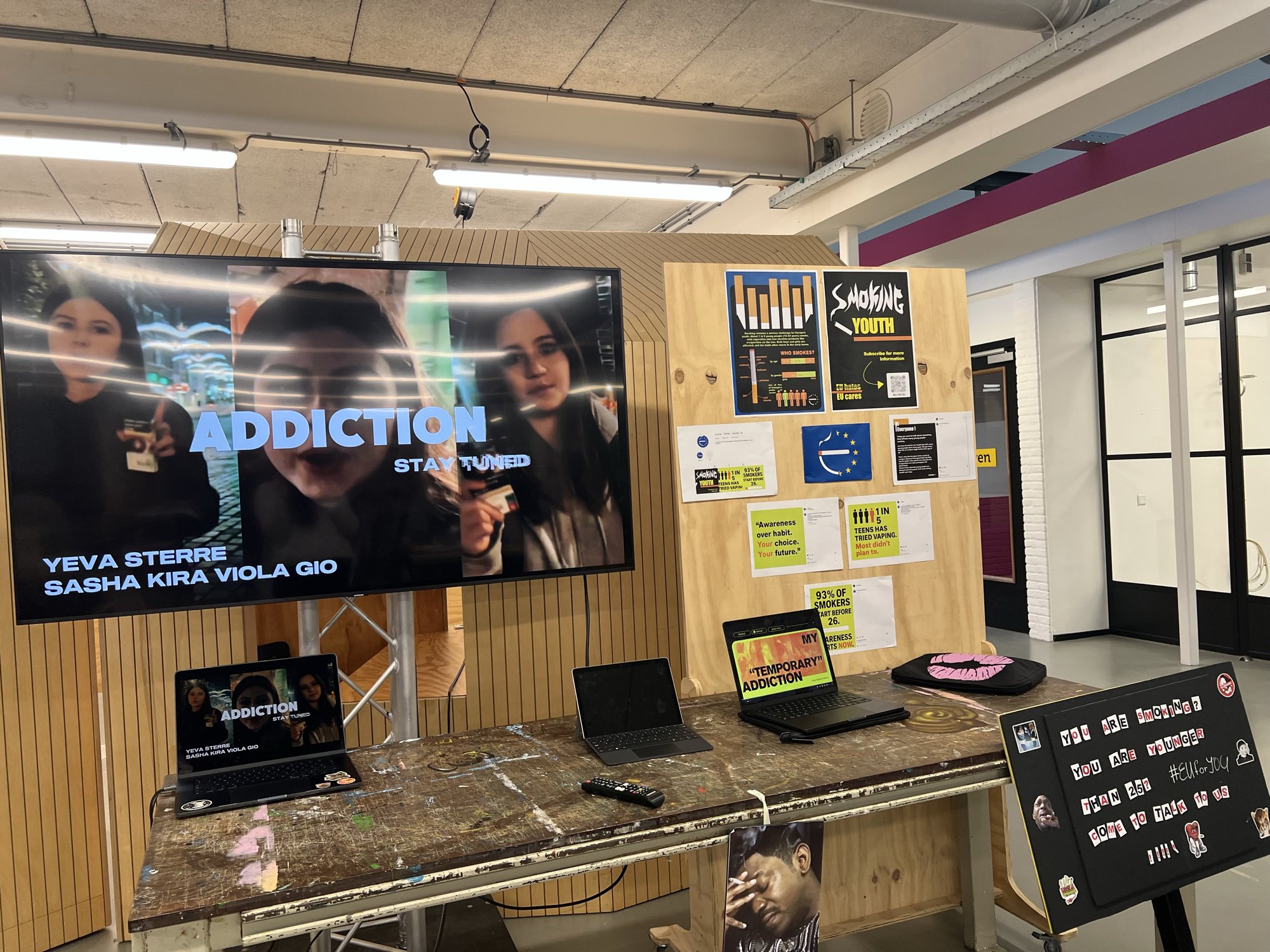 Project presentation display with campaign materials and the presentation cover